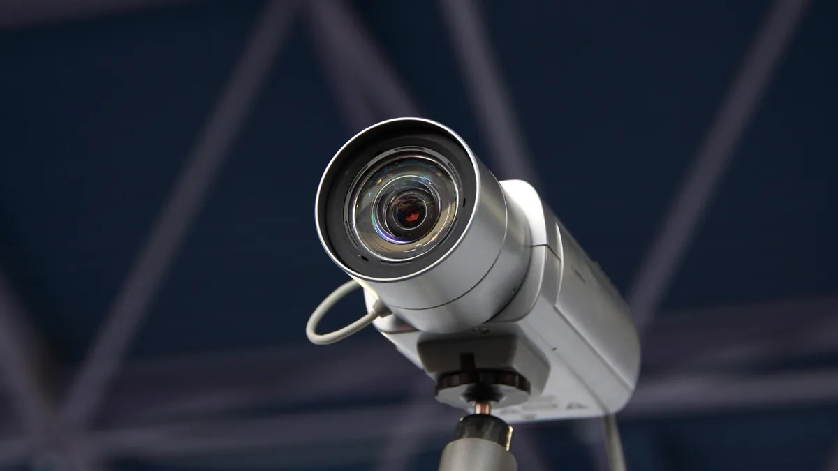 Weatherproof bullet CCTV camera mounted at a Bangalore home entrance with concealed cable routing