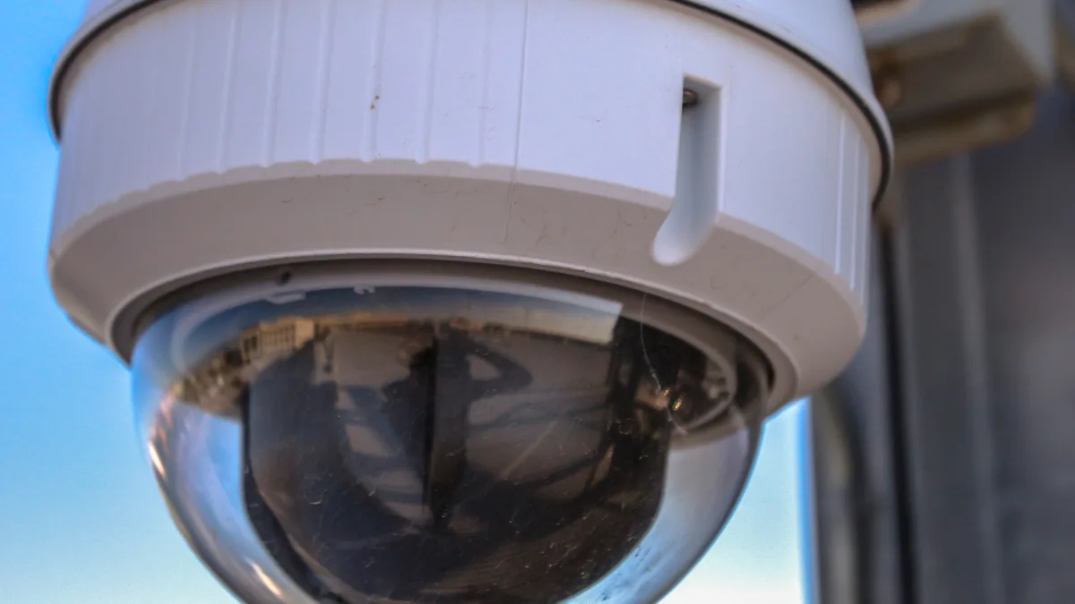 Mini dome CCTV camera mounted flush inside a gypsum false ceiling panel in a Bangalore apartment
